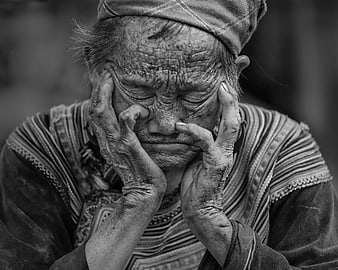 Emotional Black and White Portrait of Elderly Asian Woman