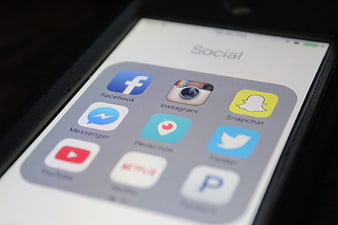 Close-up of Smartphone Screen with Social Media App Icons