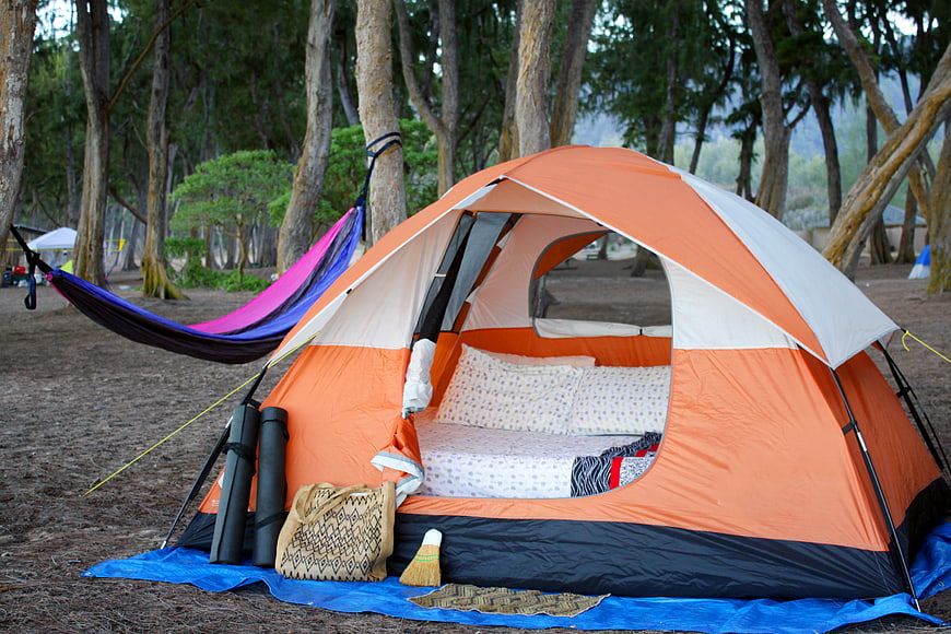 Orange Camping Tent with Hammock in Forest