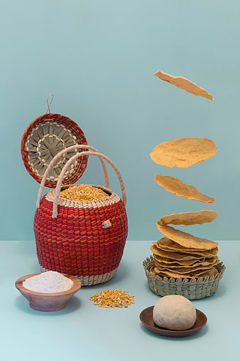 Floating tortilla chips and corn ingredients in woven basket