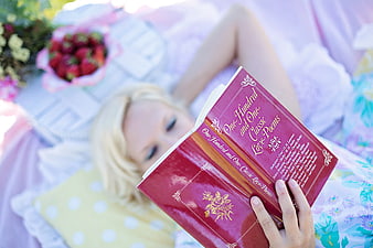 Woman Reading Classic Love Poems on Bed