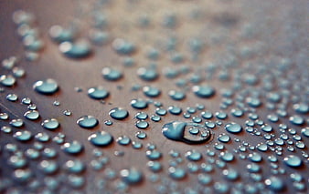 Macro Close-Up of Water Droplets on a Dark Surface