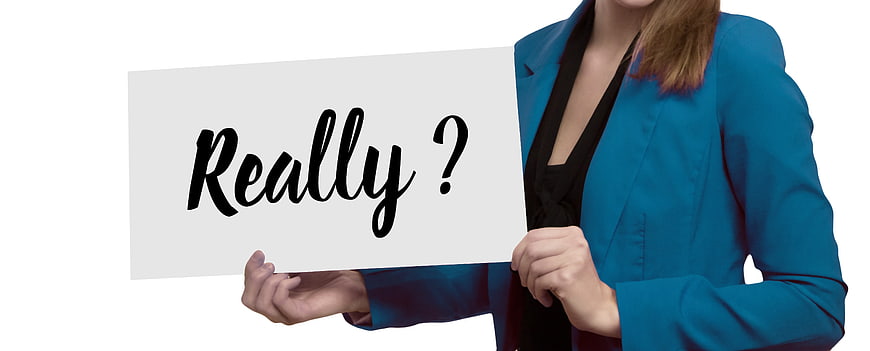 Businesswoman holding white sign with Really question mark text