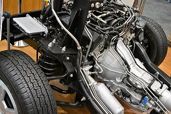 Exposed Car Chassis with Engine, Suspension, and Tires