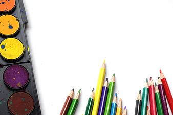 Colorful Art Supplies on White Background with Copyspace