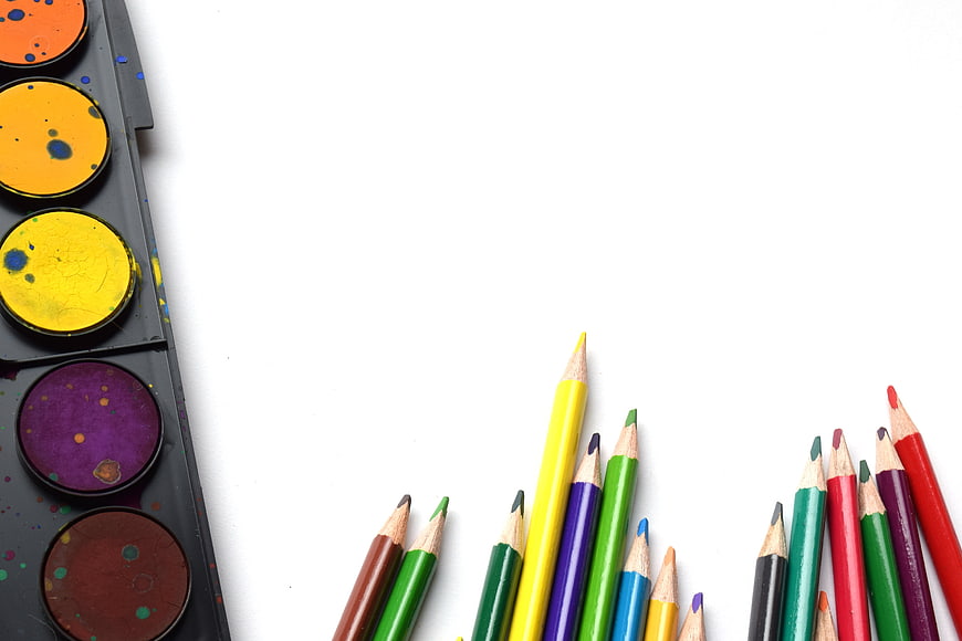 Colorful Art Supplies on White Background with Copyspace