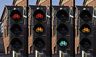 Sequence of bicycle traffic light signals showing red, amber, and green phases