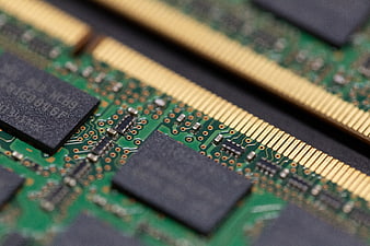 Close-up of computer RAM memory modules on green circuit board