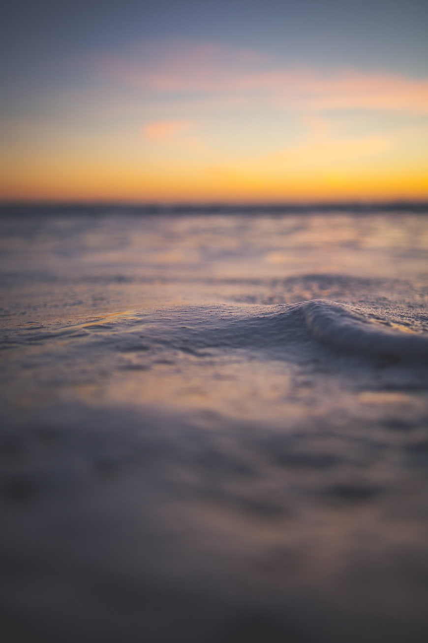 Soft Focus Ocean Waves at Sunset with Blurred Horizon