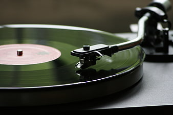 Close-up of vinyl record playing on turntable