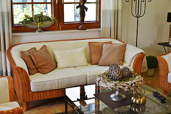 Cozy Living Room with Wicker Sofa and Natural Decor