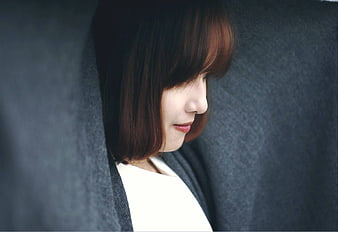 Close-up of smiling woman with short hair in profile