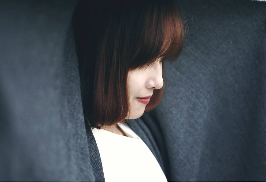 Close-up of smiling woman with short hair in profile