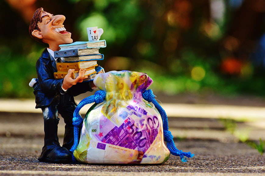 Ballooning man figurine carrying books and money bag