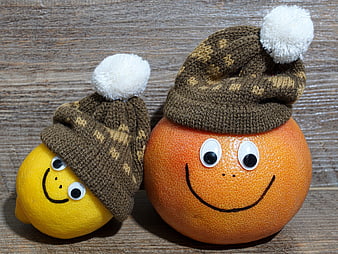 Cute Lemon and Grapefruit with Knitted Hats and Smiley Faces