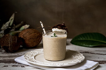 Creamy Coconut Smoothie with Fresh Garnish on Rustic Table