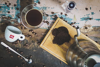 Flat lay of coffee brewing equipment on rustic wooden table