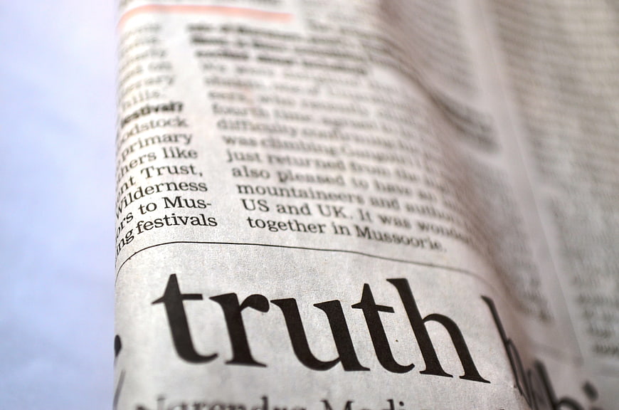 Close-up of the word truth printed on a newspaper page
