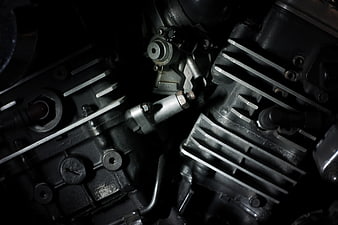 Close-up of motorcycle engine cylinders and cooling fins