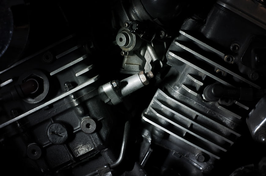 Close-up of motorcycle engine cylinders and cooling fins