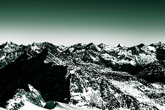 Dramatic High-Contrast Snowy Mountain Range Landscape