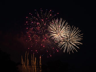 Colorful Fireworks Exploding in Night Sky