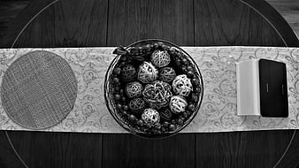 Black and White Flat Lay of Decorative Balls and Book