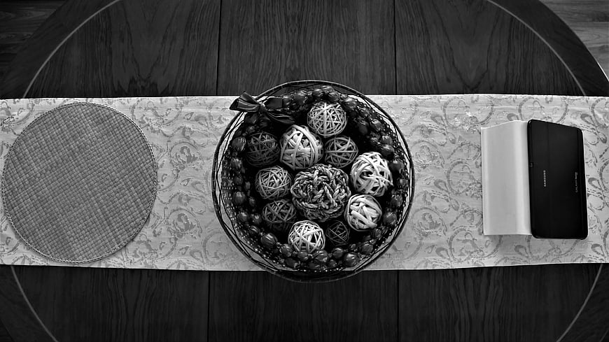 Black and White Flat Lay of Decorative Balls and Book