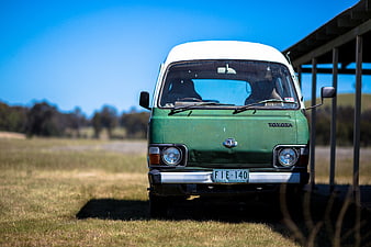 Vintage Green Toyota Van in Sunny Field
