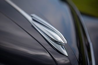 Close-up of vintage car chrome hood ornament