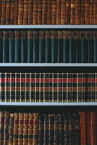 Vintage Books on Wooden Shelves in Library