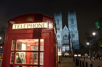 Red Telephone Booth with Westminster Abbey at Night