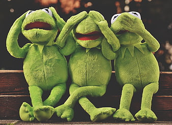 Three Kermit the Frog plush toys acting see no evil, hear no evil, speak no evil