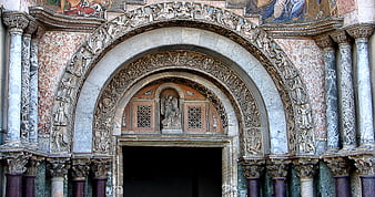 Ornate Romanesque Church Portal with Sculpted Archivolts