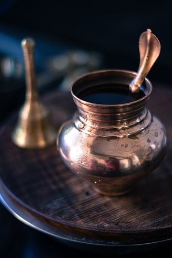Traditional Copper Kamandal Pot With Brass Bell On Wooden Tray