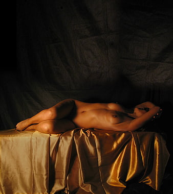 Fine Art Nude Photography of Woman on Golden Silk