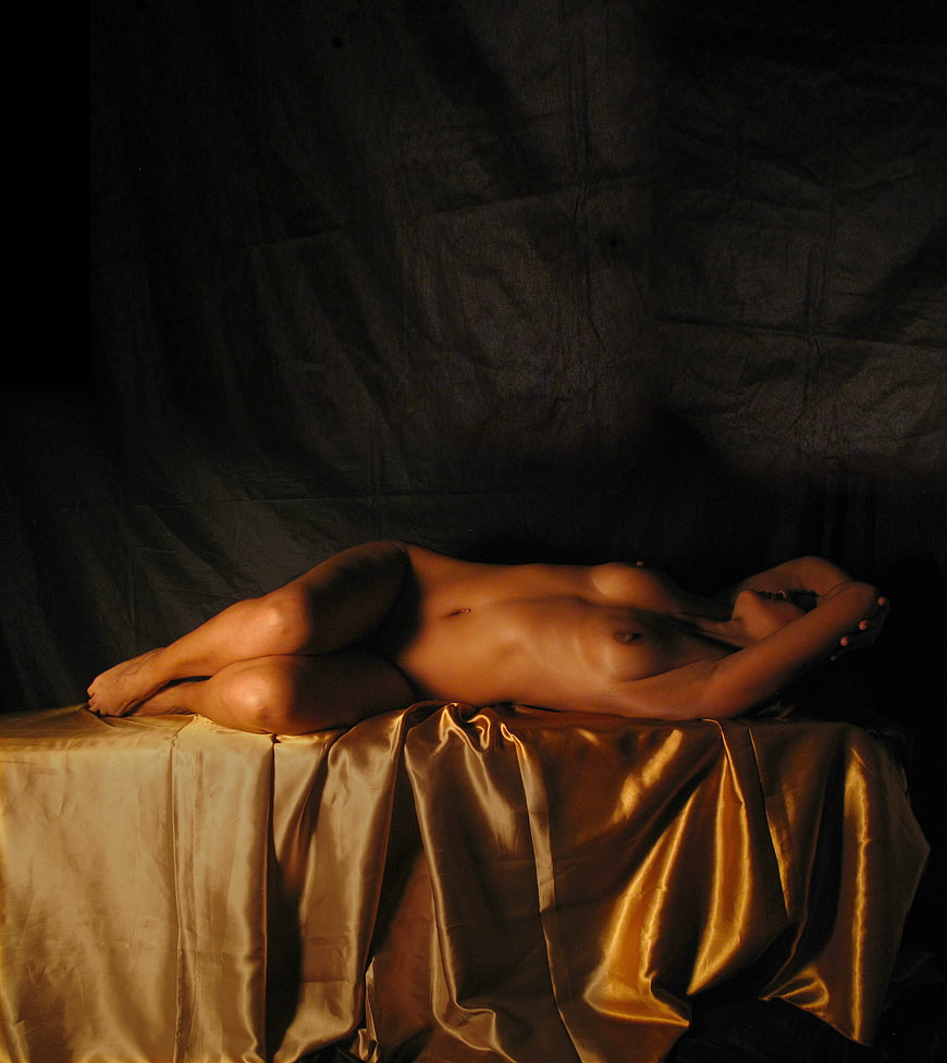 Fine Art Nude Photography of Woman on Golden Silk