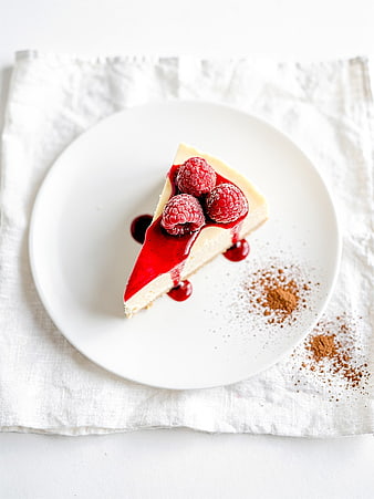 Raspberry Cheesecake Slice on White Plate