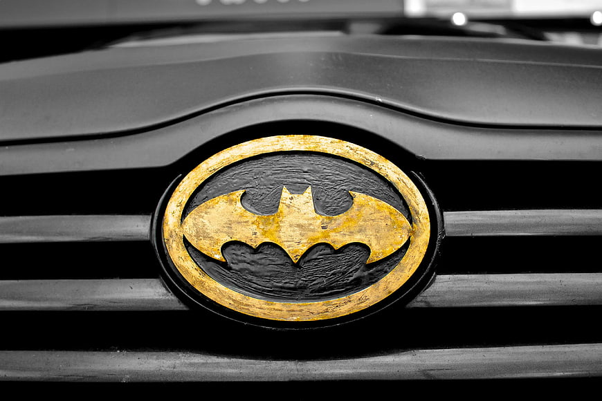 Close-up of Batman Emblem on Car Grille