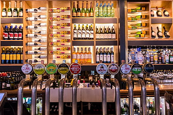 Illuminated Bar Back Bar With Beer Taps And Wine Bottles