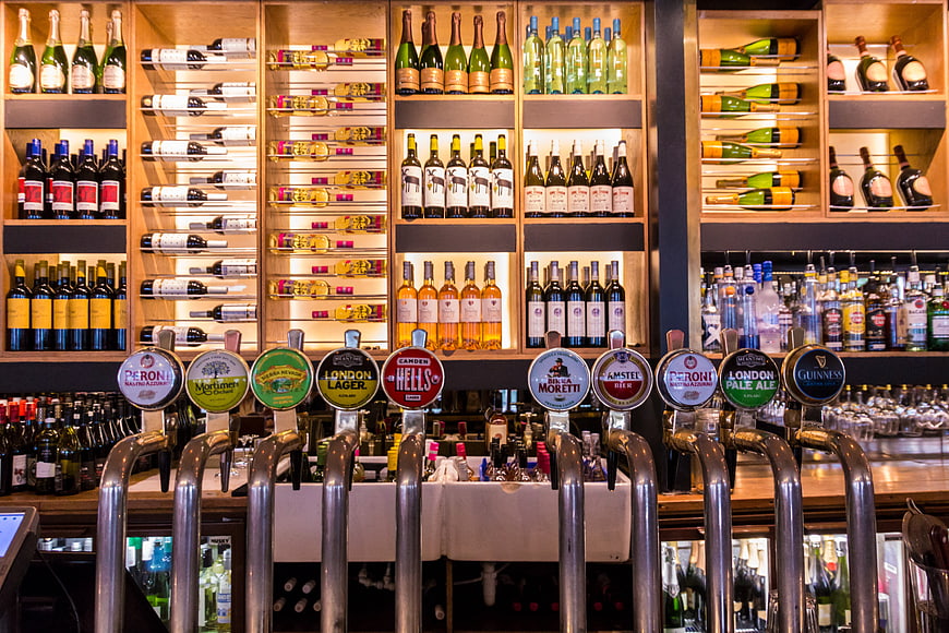 Illuminated Bar Back Bar With Beer Taps And Wine Bottles