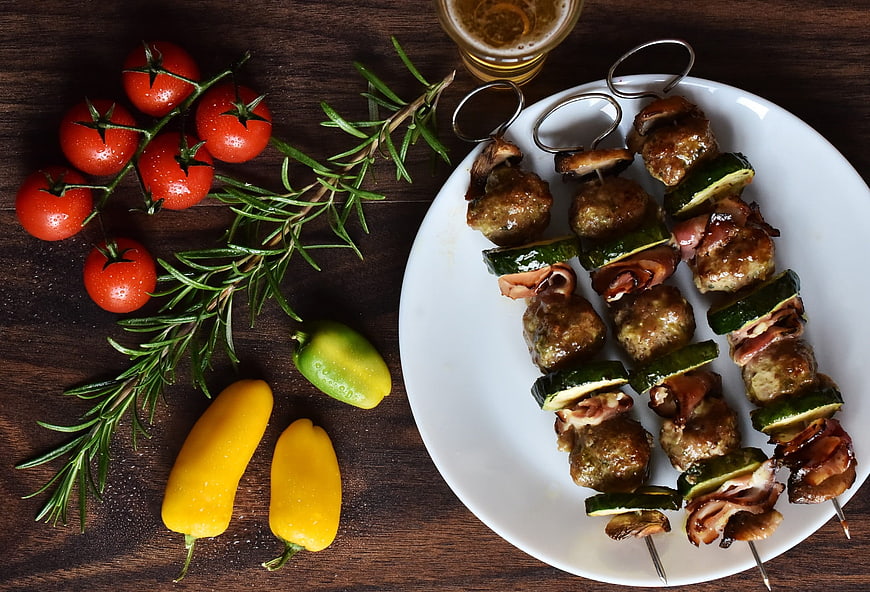 Grilled Meat Skewers With Vegetables On White Plate