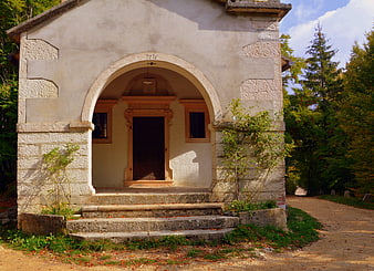 Historic Wayside Shrine With Stone Archway And Steps In Italy