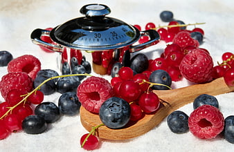 Fresh Mixed Berries With Wooden Spoon And Kitchen Scale