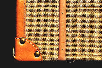 Close-up of Vintage Leather and Burlap Luggage Corner