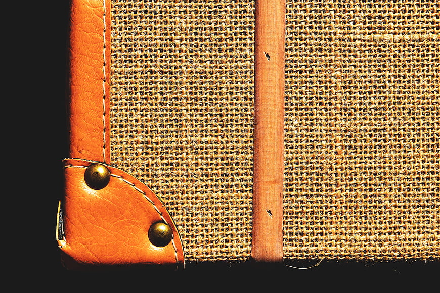 Close-up of Vintage Leather and Burlap Luggage Corner