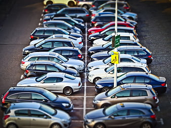 Tilt-shift miniature effect of cars in a parking lot