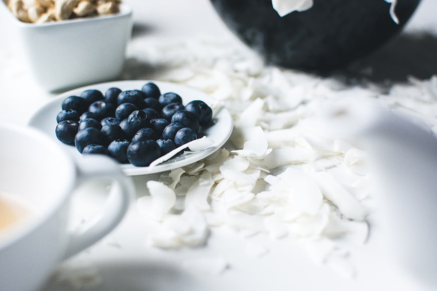 Fresh blueberries and coconut flakes healthy breakfast