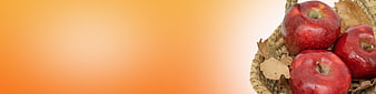 Red Apples in Wicker Basket on Orange Gradient Background