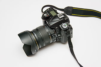 Professional DSLR Camera with Lens on White Background